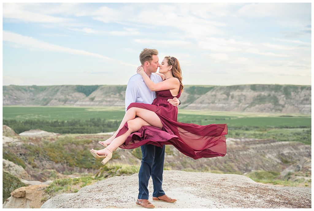 A beautiful couple embracing at their fine art rngagement photography session in Alberta Canada by Lily Laidlaw Photography
