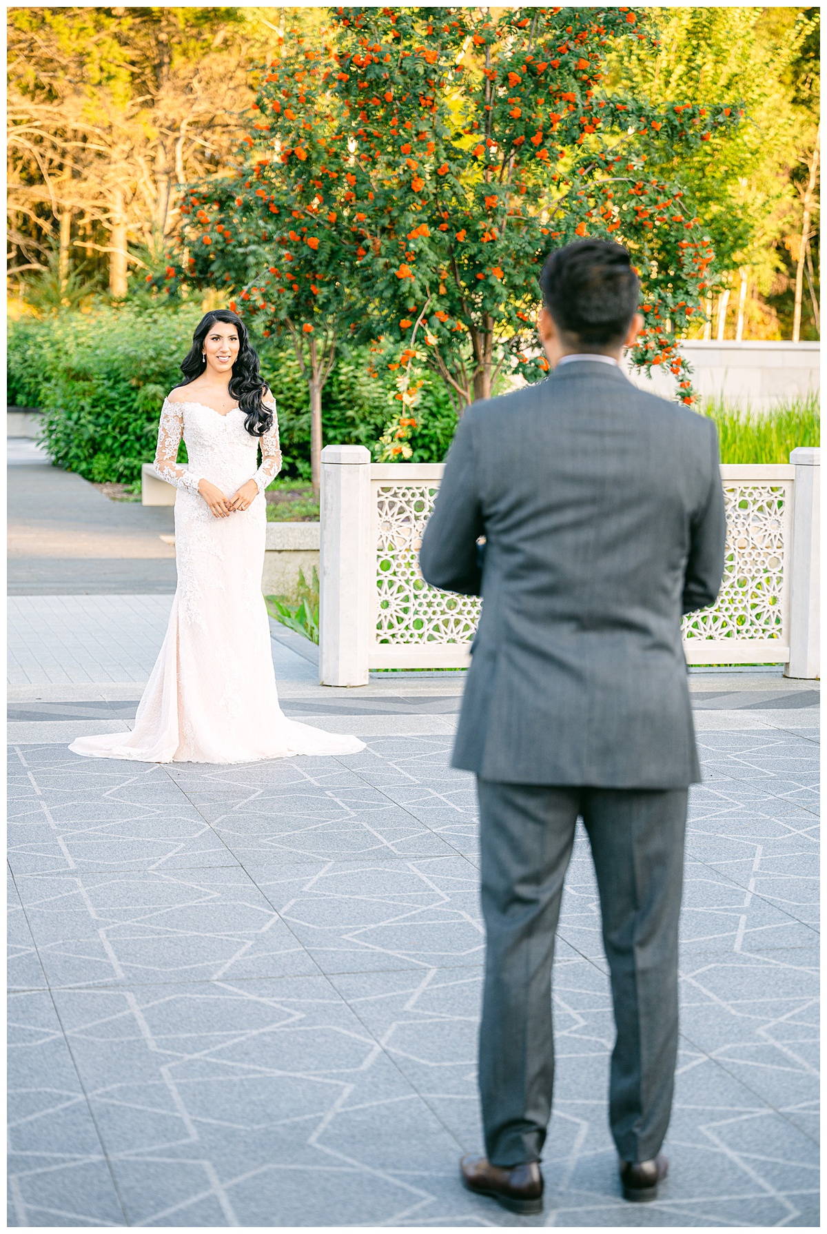 Bride and Groom doing their First Look in their wedding gown and tuxedo at the University of Alberta Botanic Gardens.