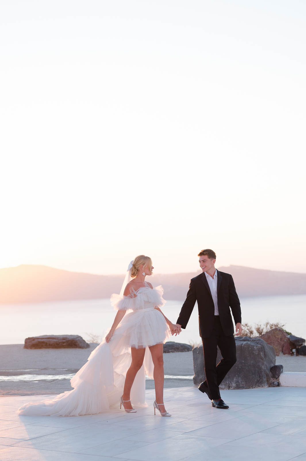 Golden Hour Wedding Photos in Santorini, Greece by Lily Laidlaw Photography.