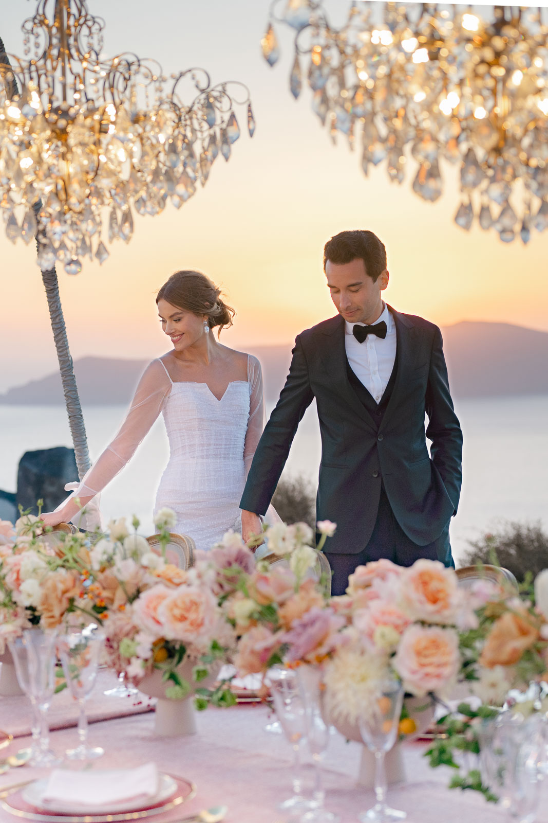 A Beautiful Bride and Groom at Sunset in Greece at their wedding reception.